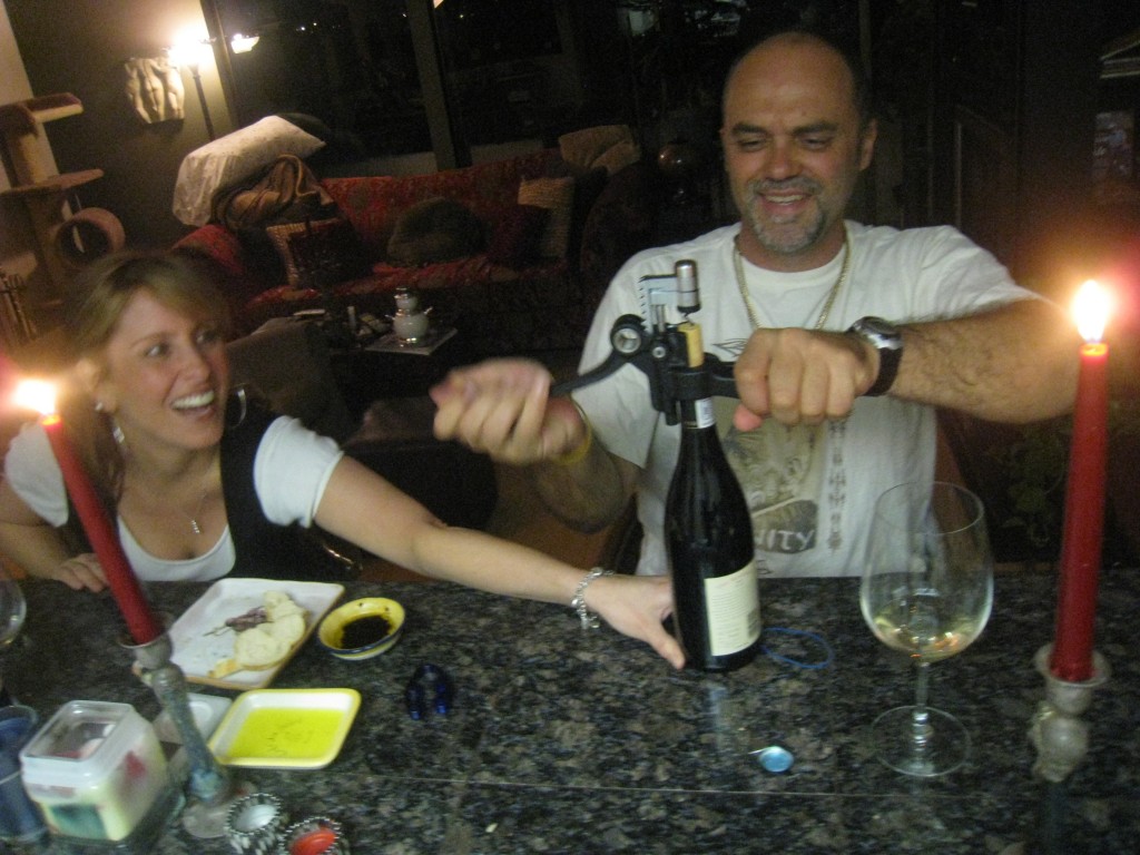 Angie assists the Gypsy Biker with an unco-operative bottle of Allan's finest....