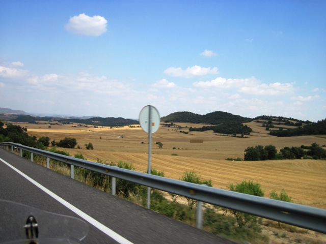 The fields of wheat along the road were an interesting contrast of colour, with the green patches of trees and the blue sky...