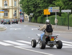 It is not unusual to see street-legal quads buzzing around on the busy city roads...
