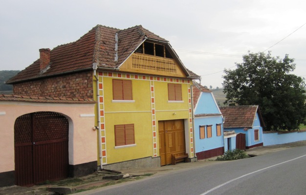 28. In the smaller villages, houses are set very close to the road...