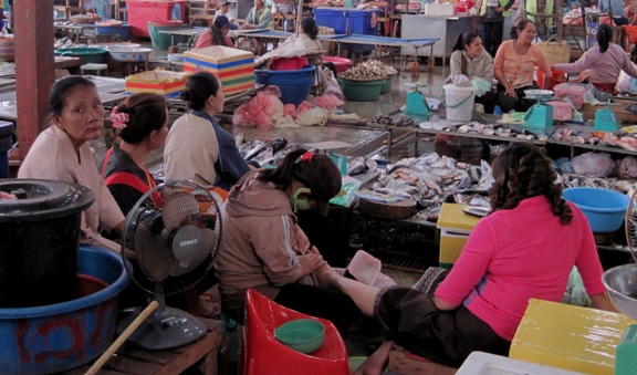 13. When business was a bit slow, these ladies gave each other a pedicure... In amongst all the produce on sale...!!