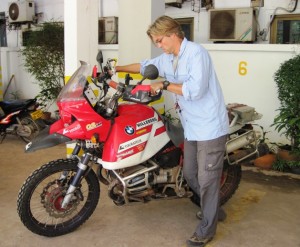 3. While Simon hides a smile and pretends to look interested in something on his bike...