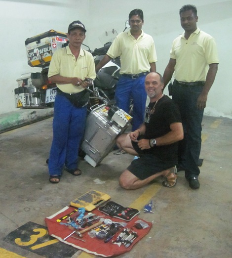1. The maintenance crew assist with the repairs to my pannier... See...!! It's not all play, you know...!!