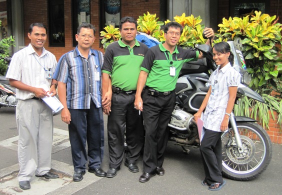 9. The Team gather for a final photo with the precious cargo they had helped clear through Indonesian Officialdom...