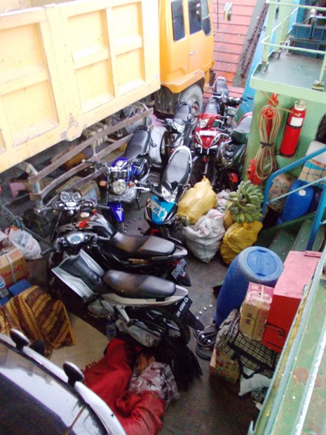 22. Scooters and people, all bedded down on the deck...