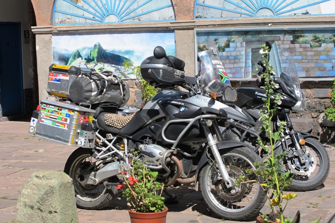 15. Sunnier days in Cuzco... The Big Fella and Adrian's Kawasaki had the courtyard to themselves... But not for long...!!