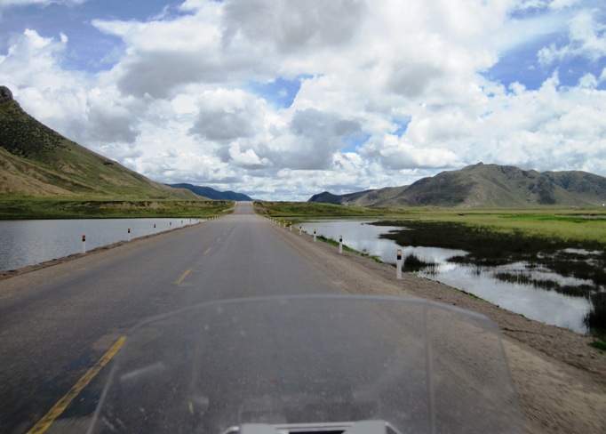 4. The recent rain had filled every hollow along the road, and the wind blowing over the water made things even colder...!!