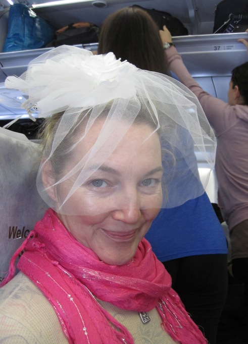 2. Ever the Princess...!! Patricia wore her "Facinator" on the plane...!! I can't complain though, as it got us a free bottle of Moet Chandon Champagne...!!
