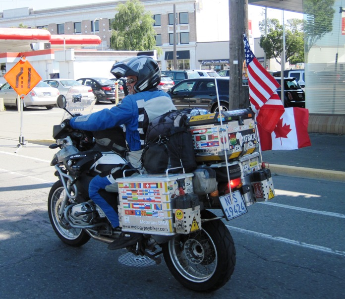 6. Riding through the bust streets of Victoria, Vancouver Island... Chenty had wedged a Canadian flag onto the back of the bike to go with the two that were already flying there...
