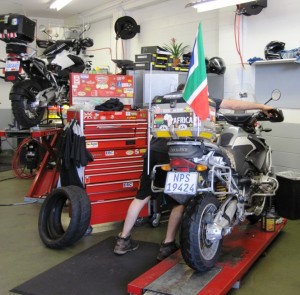 Mark's bike is already on it's lift, while the Big Fella gets pushed onto his own "operating table"...