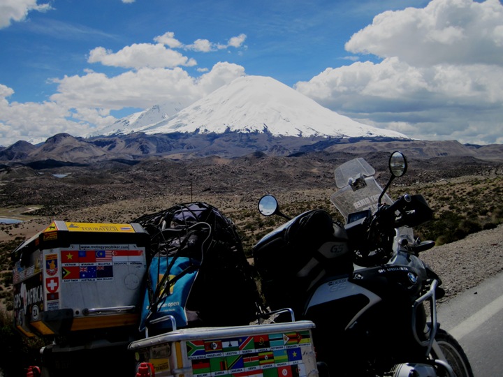 Volcano in the clouds. The Bolivian border post was just a few kilometres from here. I had ridden dirt roads for three hours to get here and was exhausted by the ecombination of effort and altitude....