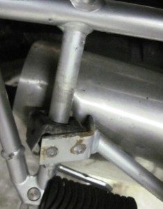 The luggage frame had been pushed back onto the muffler.