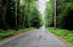 Riding through heavily forested country roads north of Gardner, heading for the New Hampshire state line.