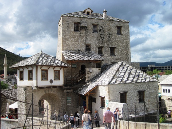 9. Collection of stone buildings on the far side of the bridge...