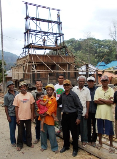 3. The Watuneso village senior council, with Chief Jonni in ornage jacket holding his daughter...