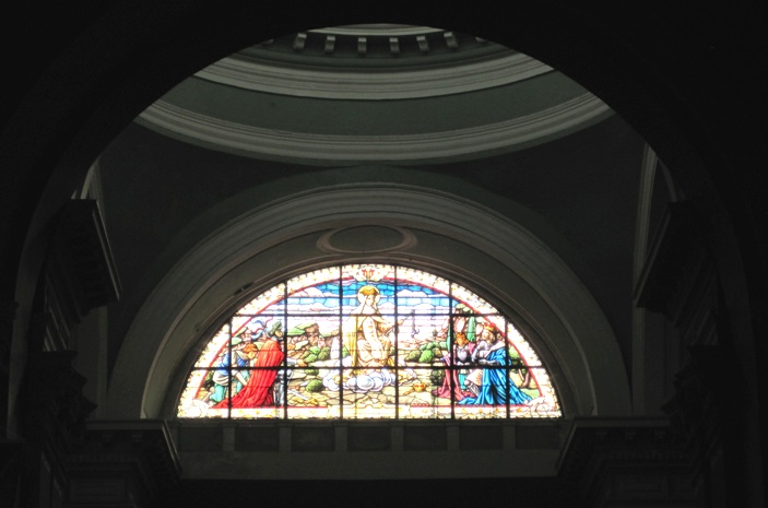 30. The stained glass window above the altar...