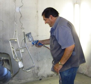 The pannier frames being sprayed after much work and cursing had gone into straightening them.
